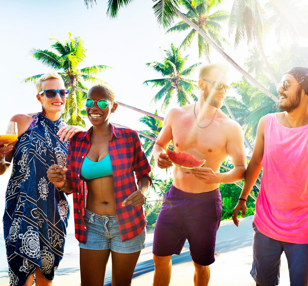 four adults at a pool party