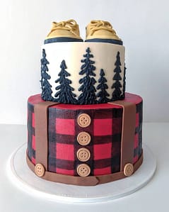plaid lumberjack baby shower cake with shoes on top