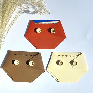 three diaper shaped gift card holders in fall colors