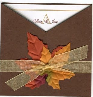 a fall brown square wedding invitation with silk leaves