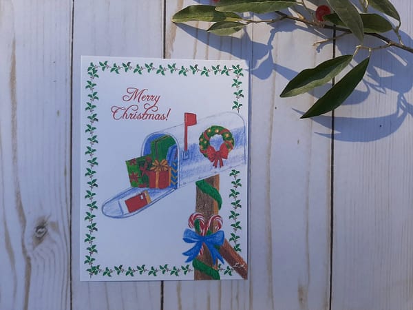 postcard with a hand-drawn with garland and a wreath
