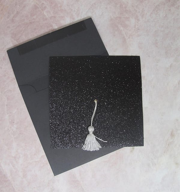 black glitter graduation invitation with black envelope