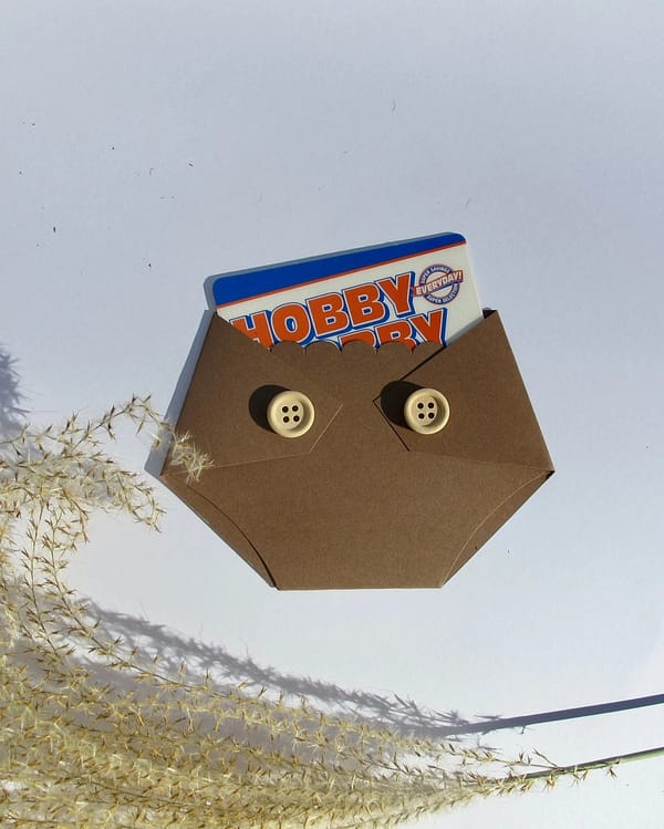 brown diaper shaped gift card holder with wooden buttons