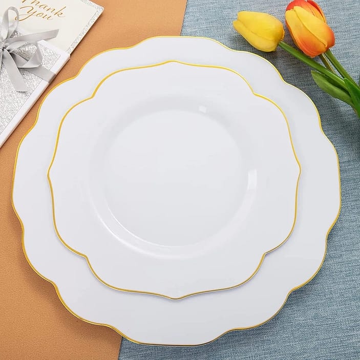 gold rimmed party plates with a decorative edge