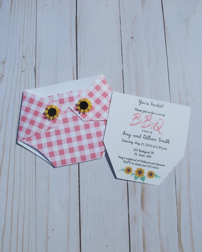 diaper shaped baby shower invitation in a pink plaid pattern with sunflowers