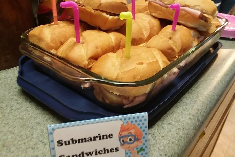 mini Subsandwiches with straws in the tops to look like submarines